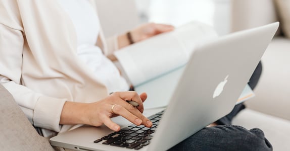 Researcher analysing participant data during online qualitative research session.