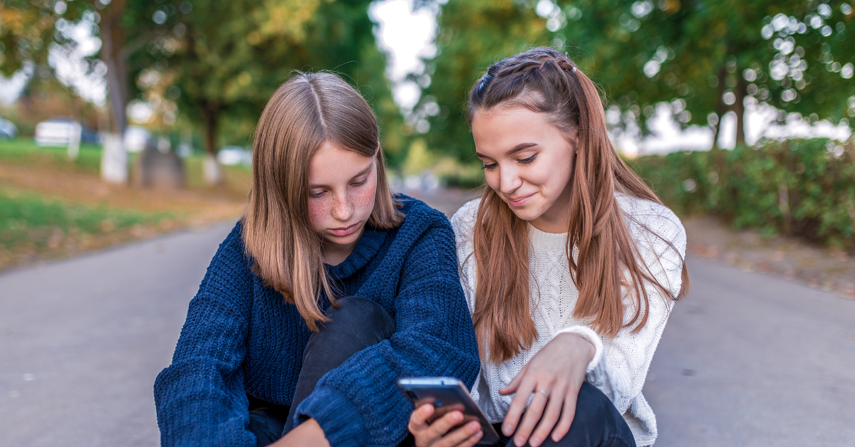 Two children taking part in friendship pair research with an online moderator