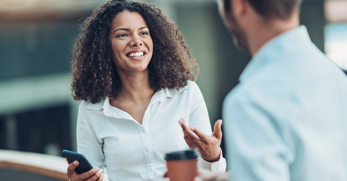 Researcher recruiting participants for intercept interviews in a shopping centre