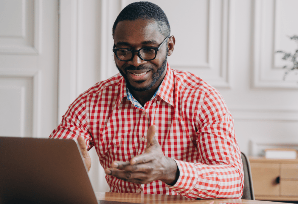 A man taking part in an online focus group, representing ideas from a focus group recruitment agency.