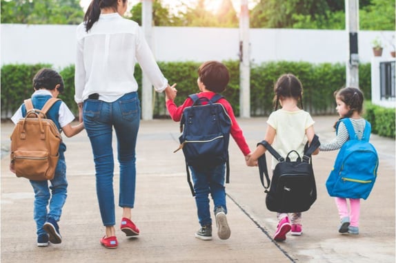 parent with children going to school