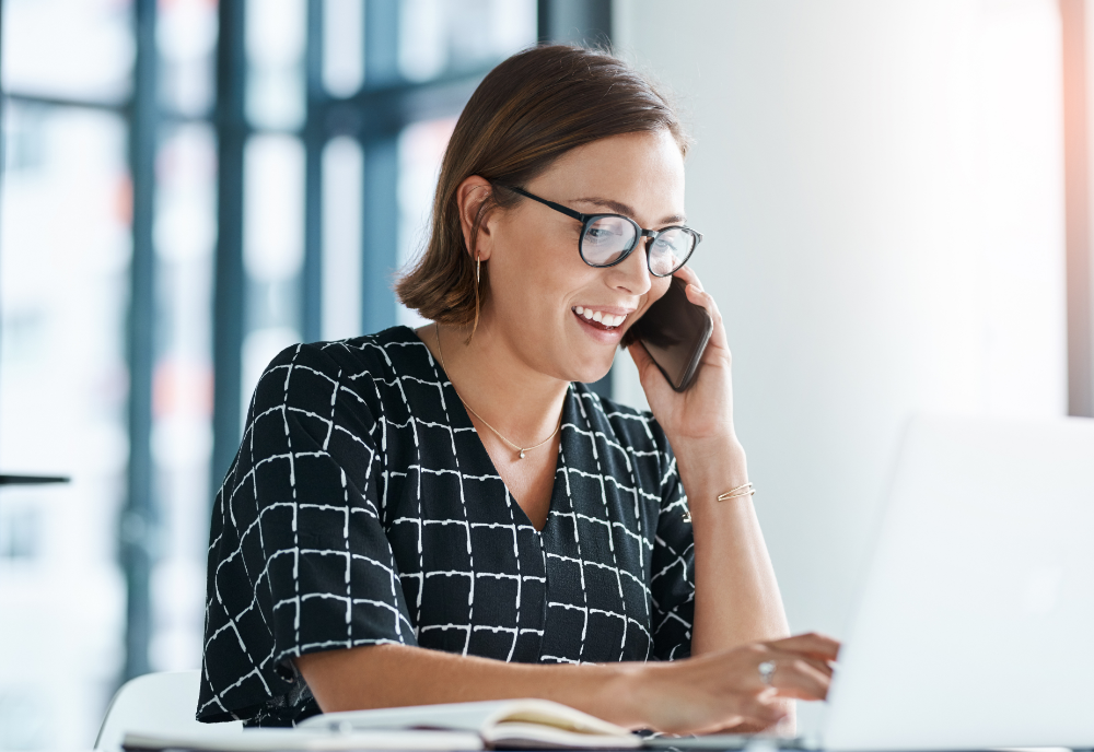 A woman conducting a market research screener over the phone to find research participants.