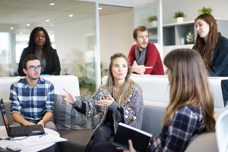 Group of market researchers discussing focus group research