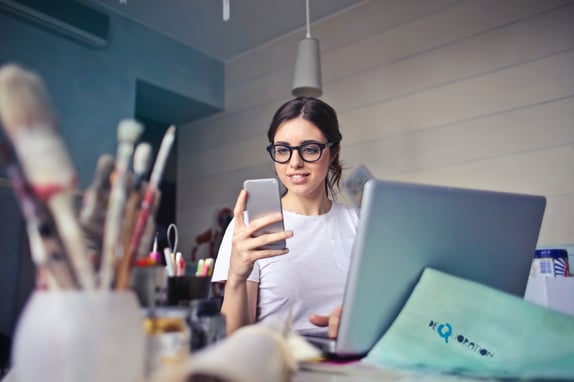 young person using smartphone for market research