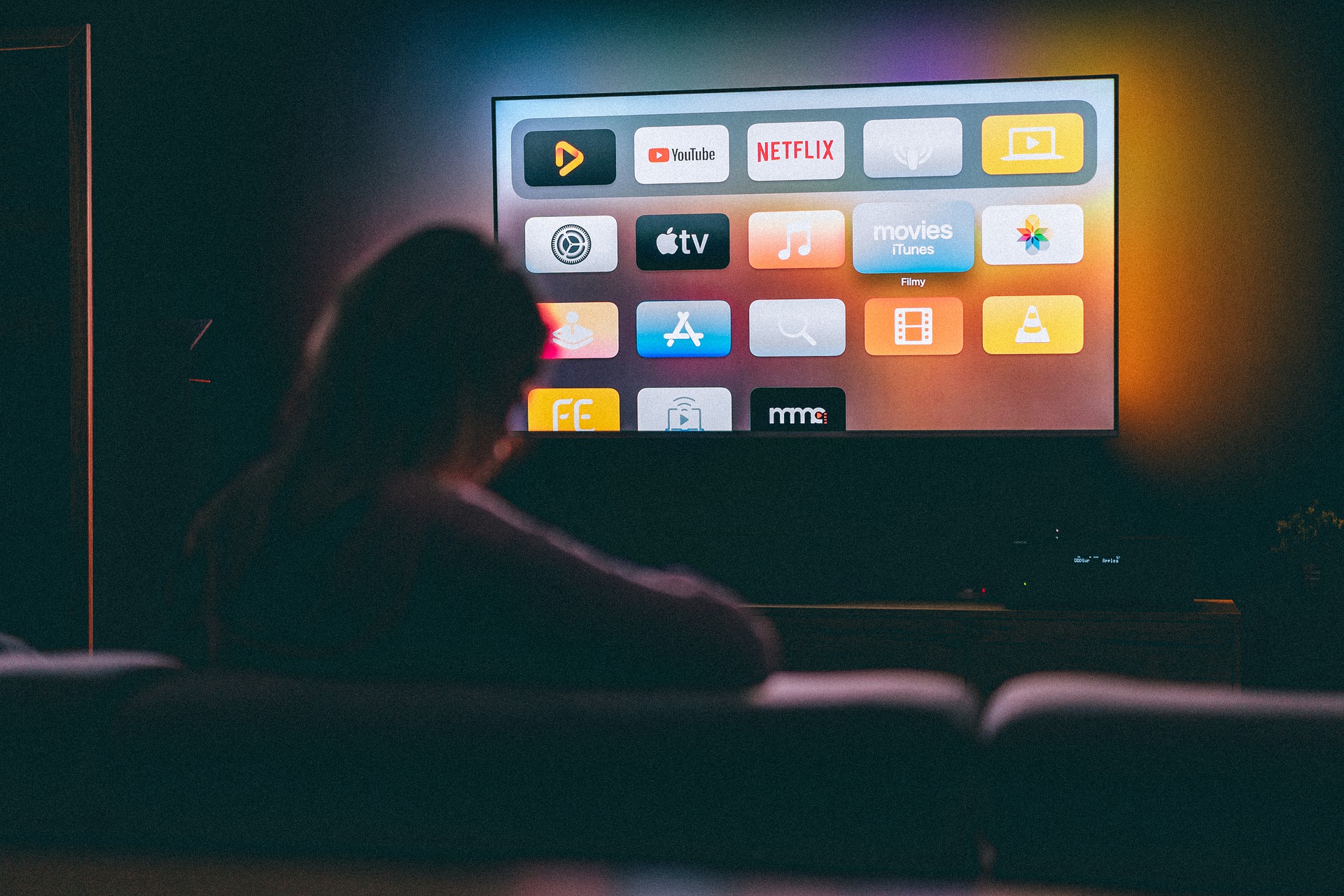 A person selecting which app to use to watch a show, representing recruiting participants for media research  