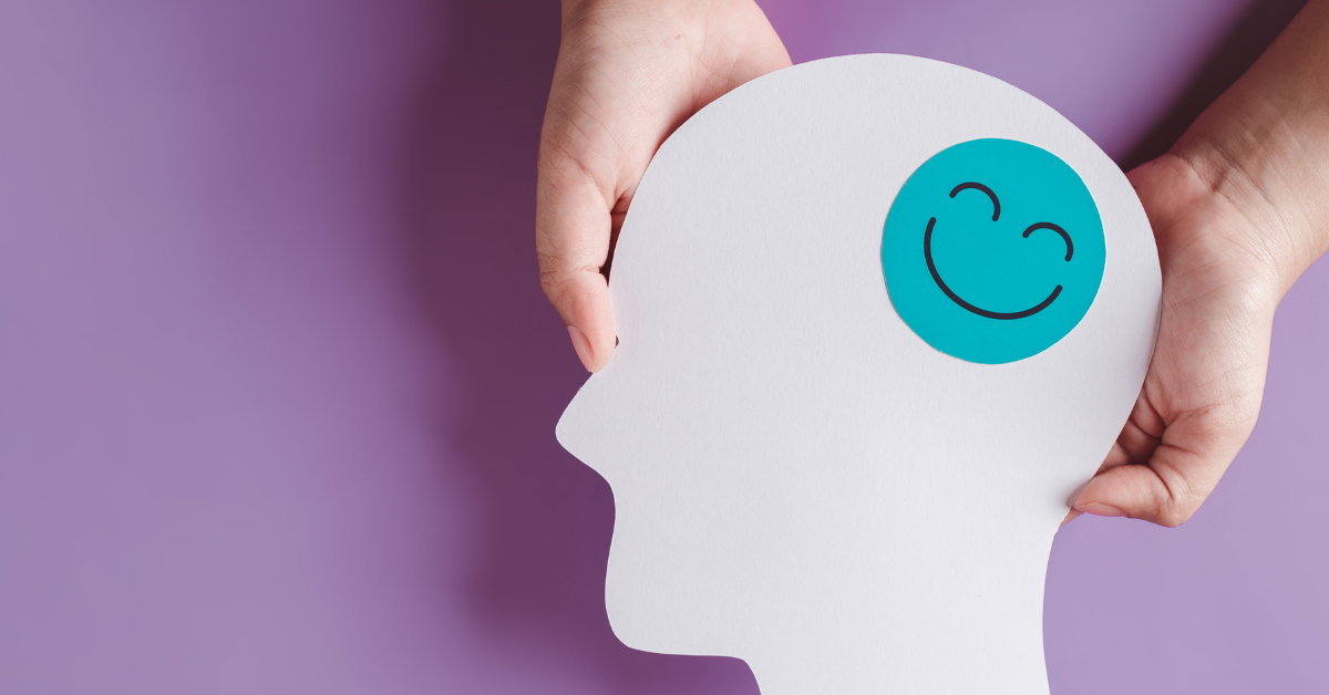 paper person with smiley face representing brain
