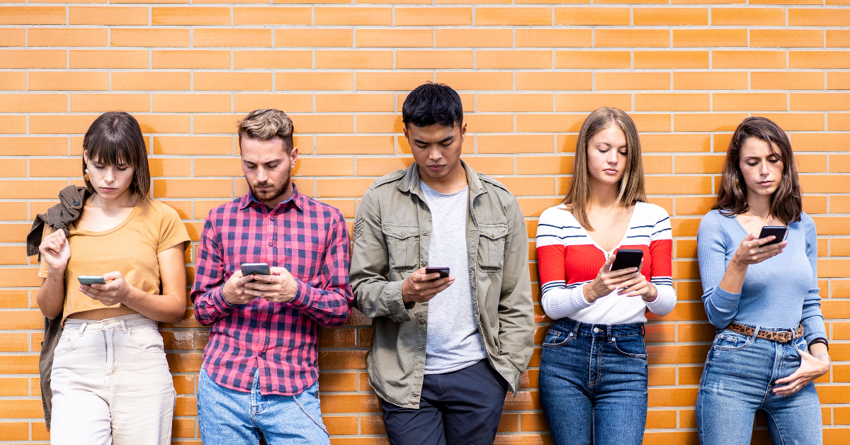 Group of Gen Z taking part in market research on their phones