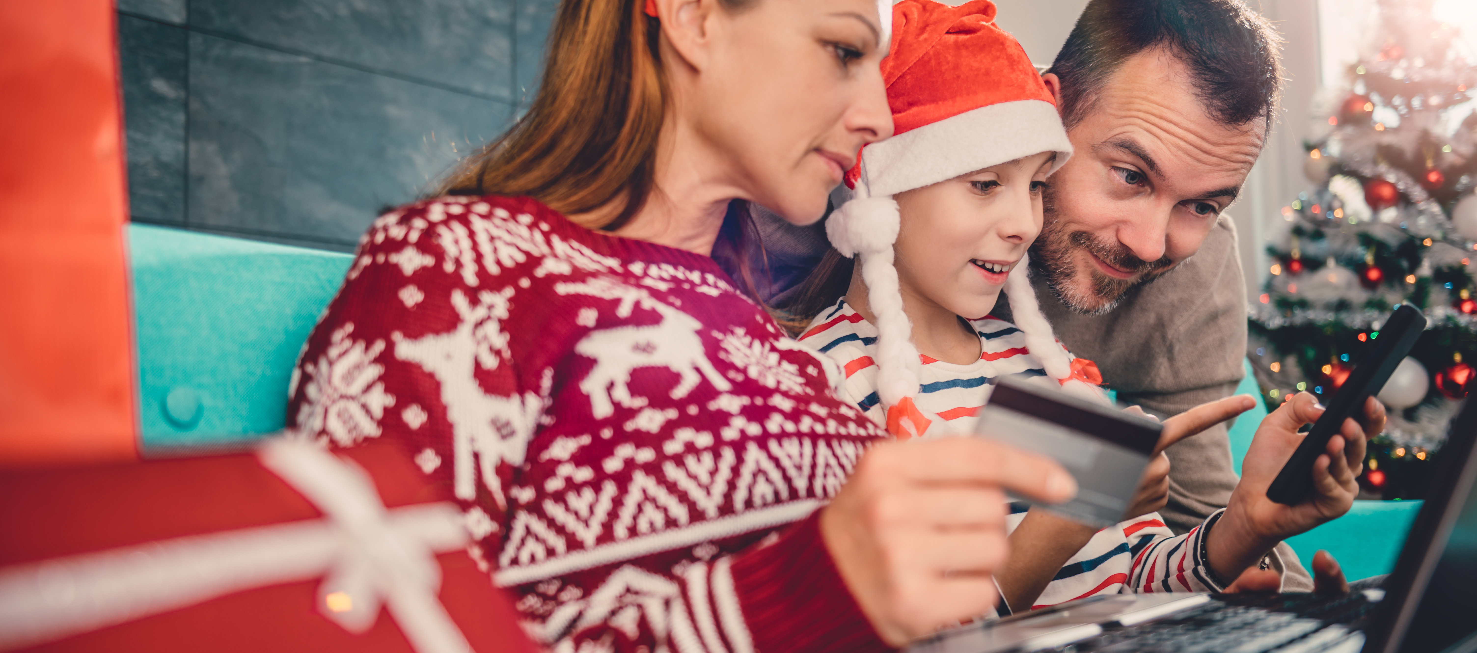 A family at Christmas making online purchases during Lockdown 2.0