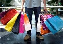 man carrying shopping bags