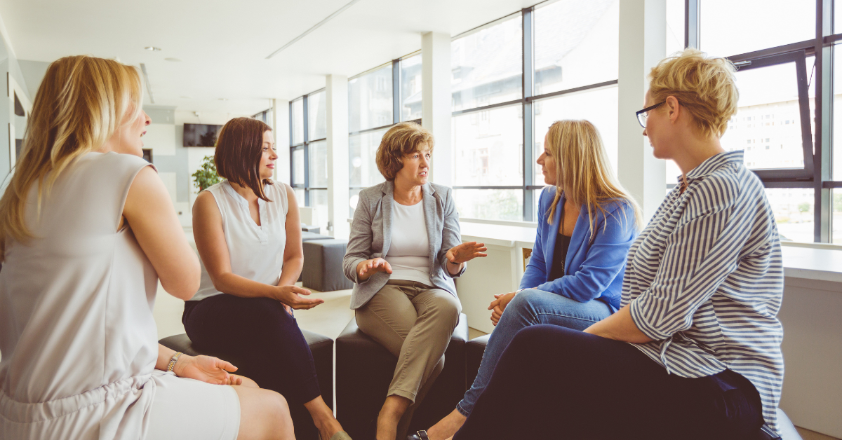 Group of researchers discussing focus group mistakes