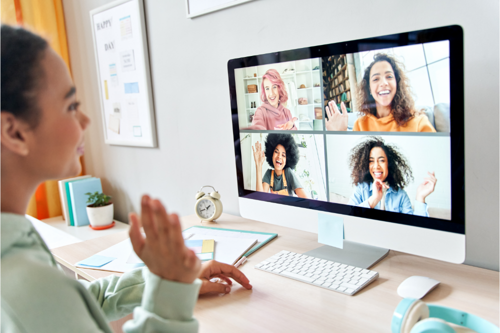 4 people on screen and one tlaking to them, representing a remote focus group