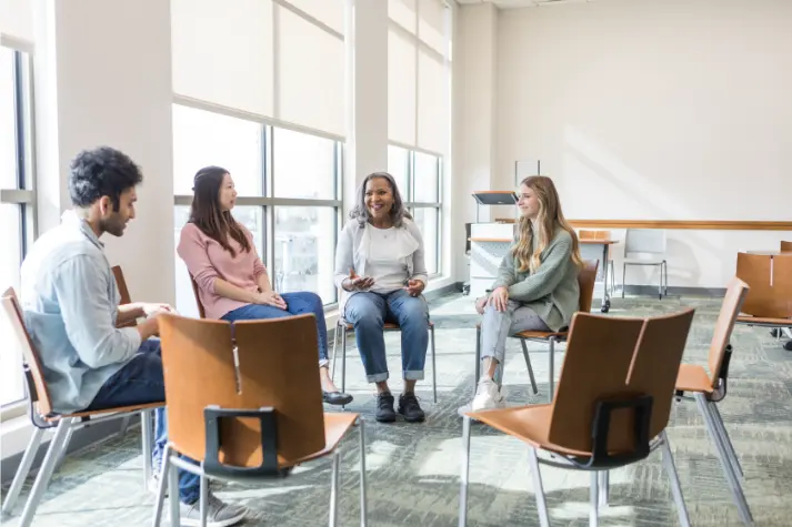 people sat around talking in a focus group